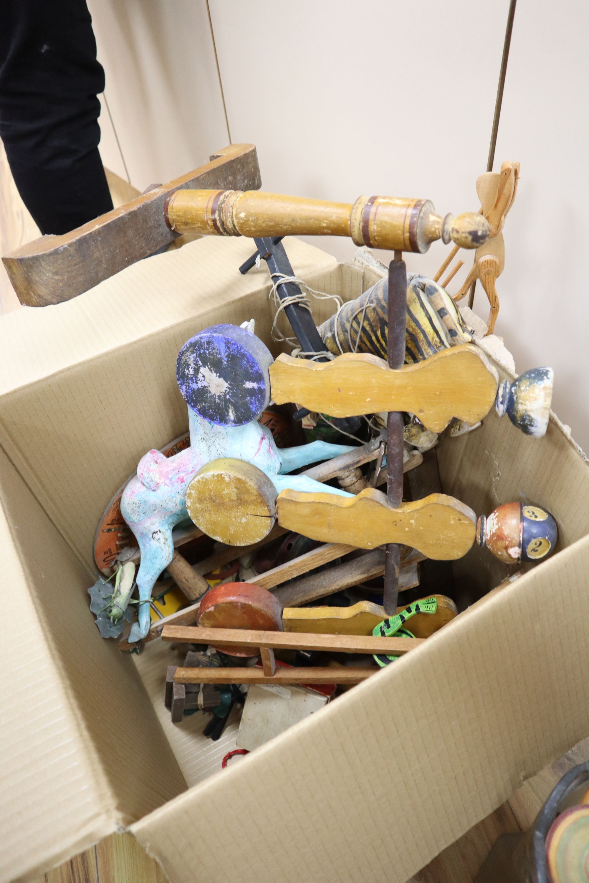 A Javanese tiger puppet, model wood rocking horse, a bowling game and quantity of mixed childrens toys games, late 19th/early 20th c